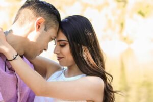 Couple making intense romantic eye contact to build deeper intimacy.