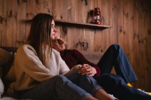 Couple sitting together having a deep conversation to fix an intimacy rut.