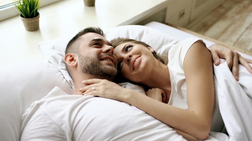 Couple whispering intimately and mastering bedroom communication.